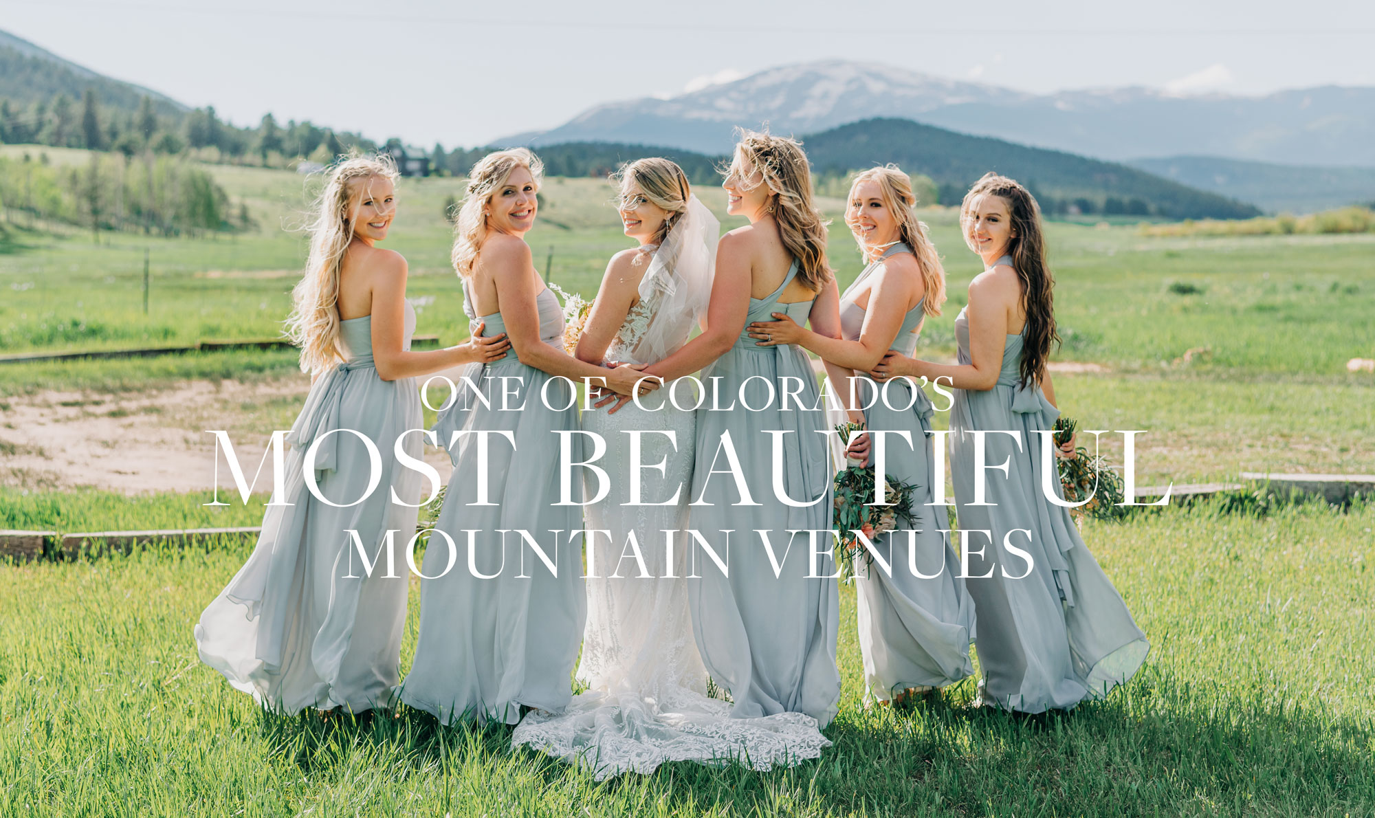 wedding party standing in front of mountains at deer creek valley ranch